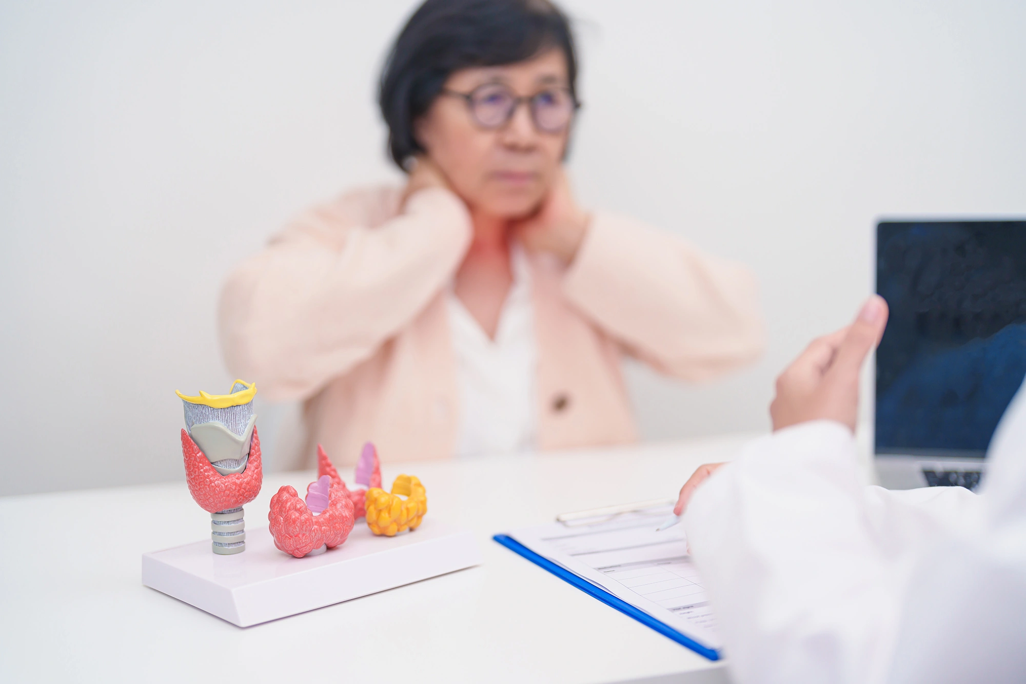 Elderly Patient consulting doctor on lumps by the jaw.
